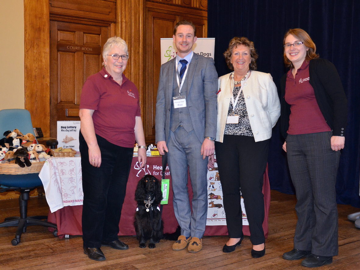 Tom and Victoria Dixon of Worcester & Stratford Hearing Centres with Merleen Watson, Vicky Ryan and hearing dog Grace of Hearing Dogs for Deaf People at the Worcester Hearing Show 2015